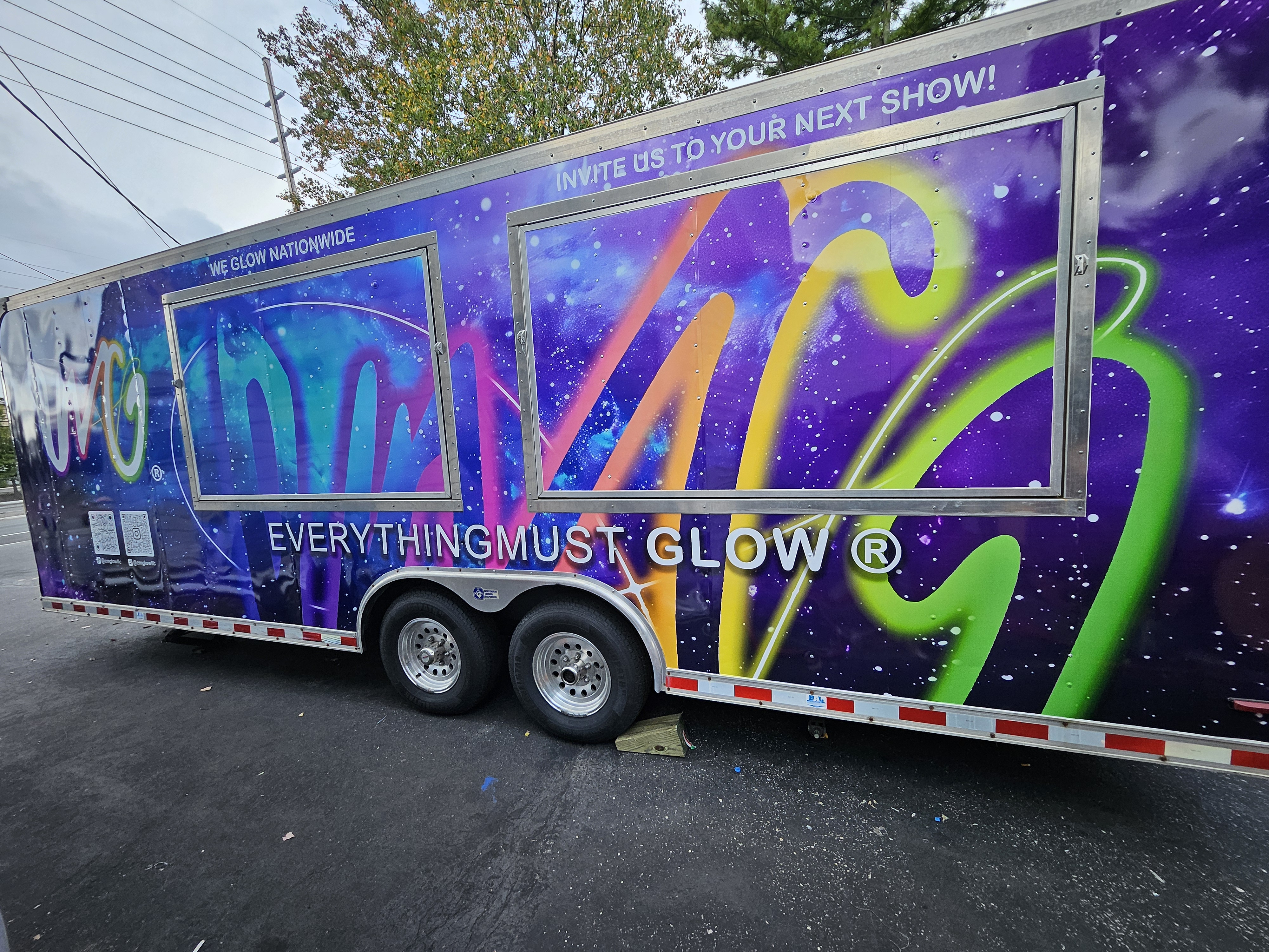 Our fully wrapped Everything Must Glow trailer — 'Invite Us to Your Next Show!'