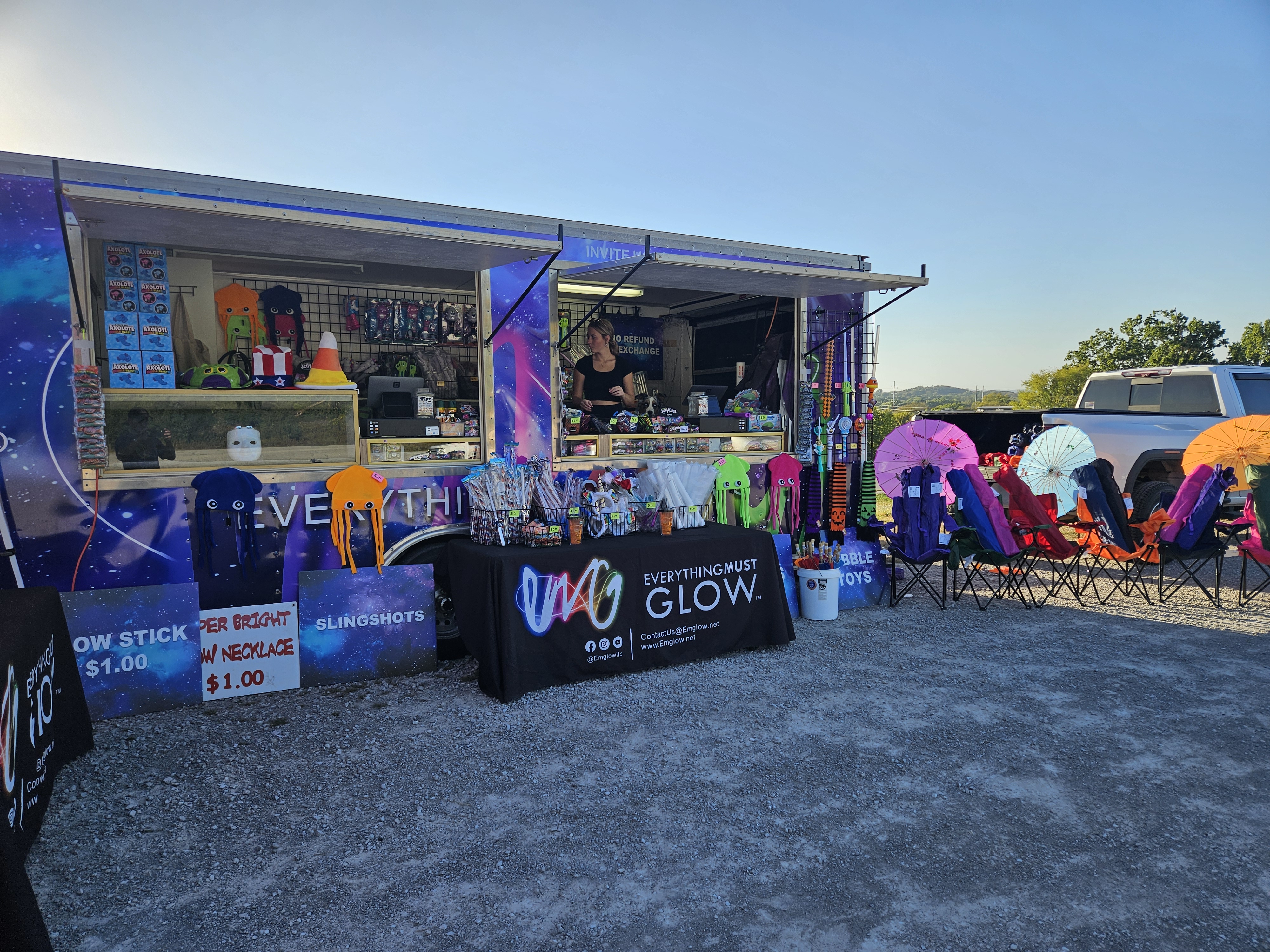 Our branded trailer open and ready, fully stocked with signs for glow sticks and slingshots