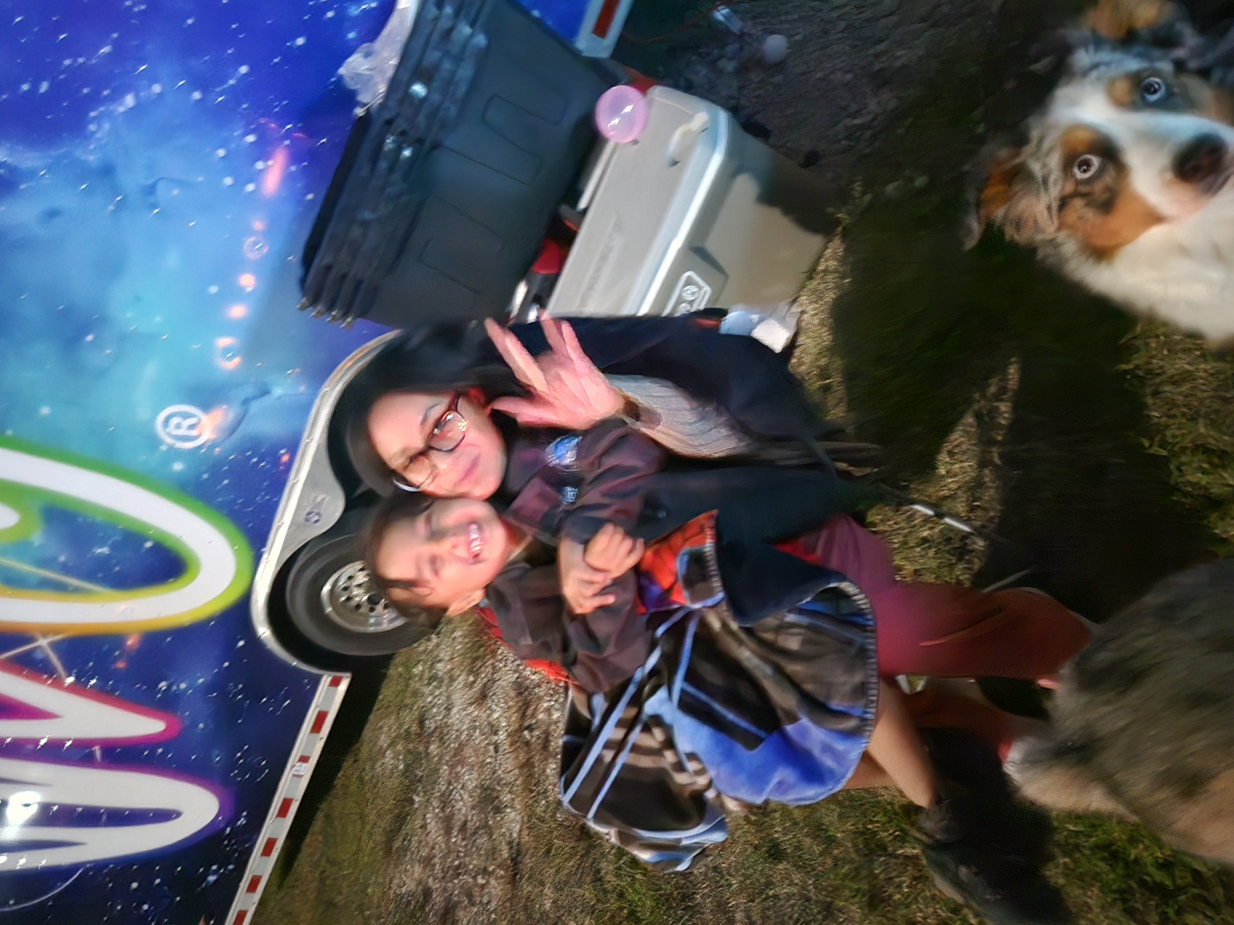 Family time by the trailer with the Aussie photobombing