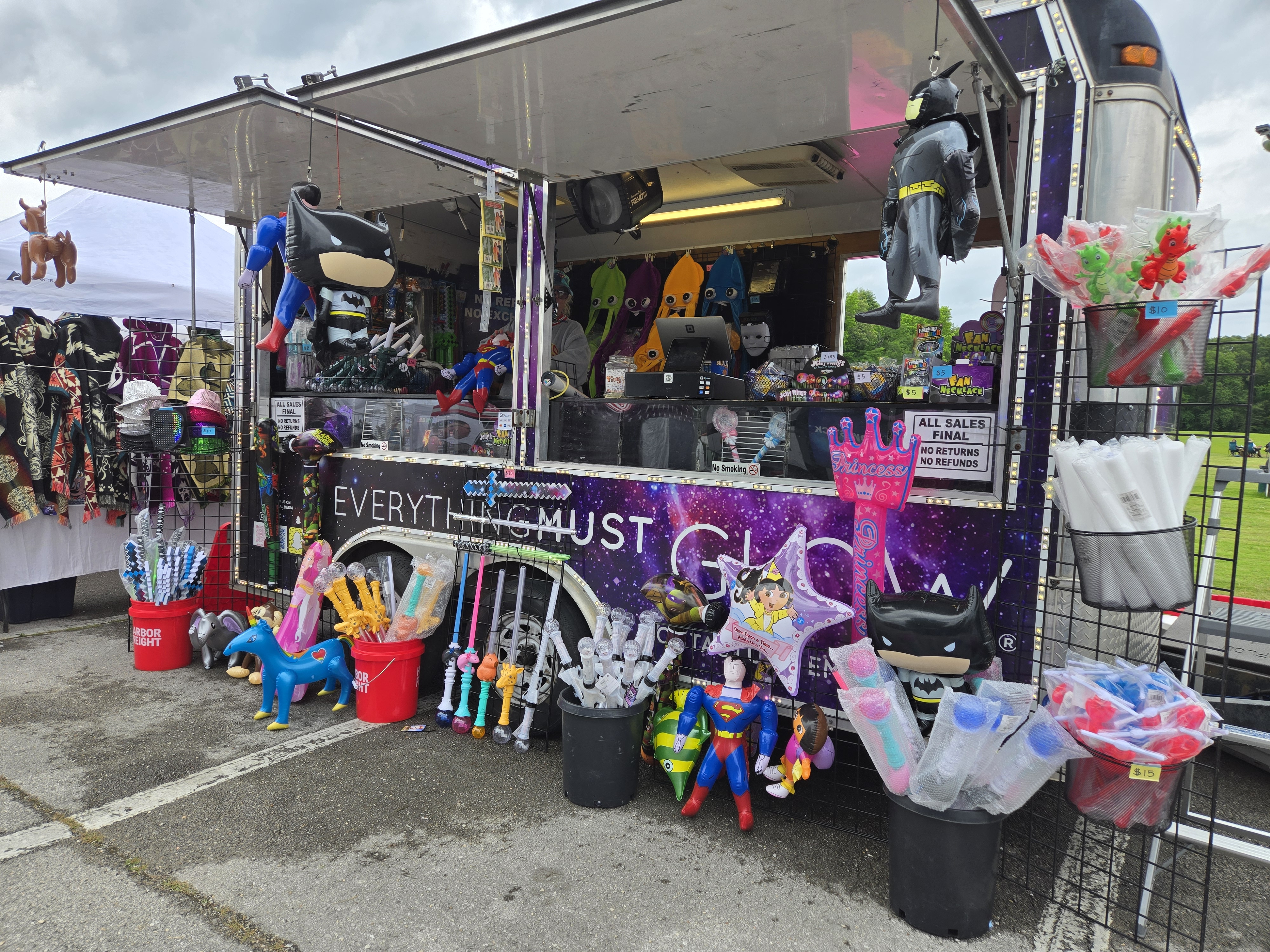 The EMG trailer open for business, packed with inflatable characters, toys, and glow gear
