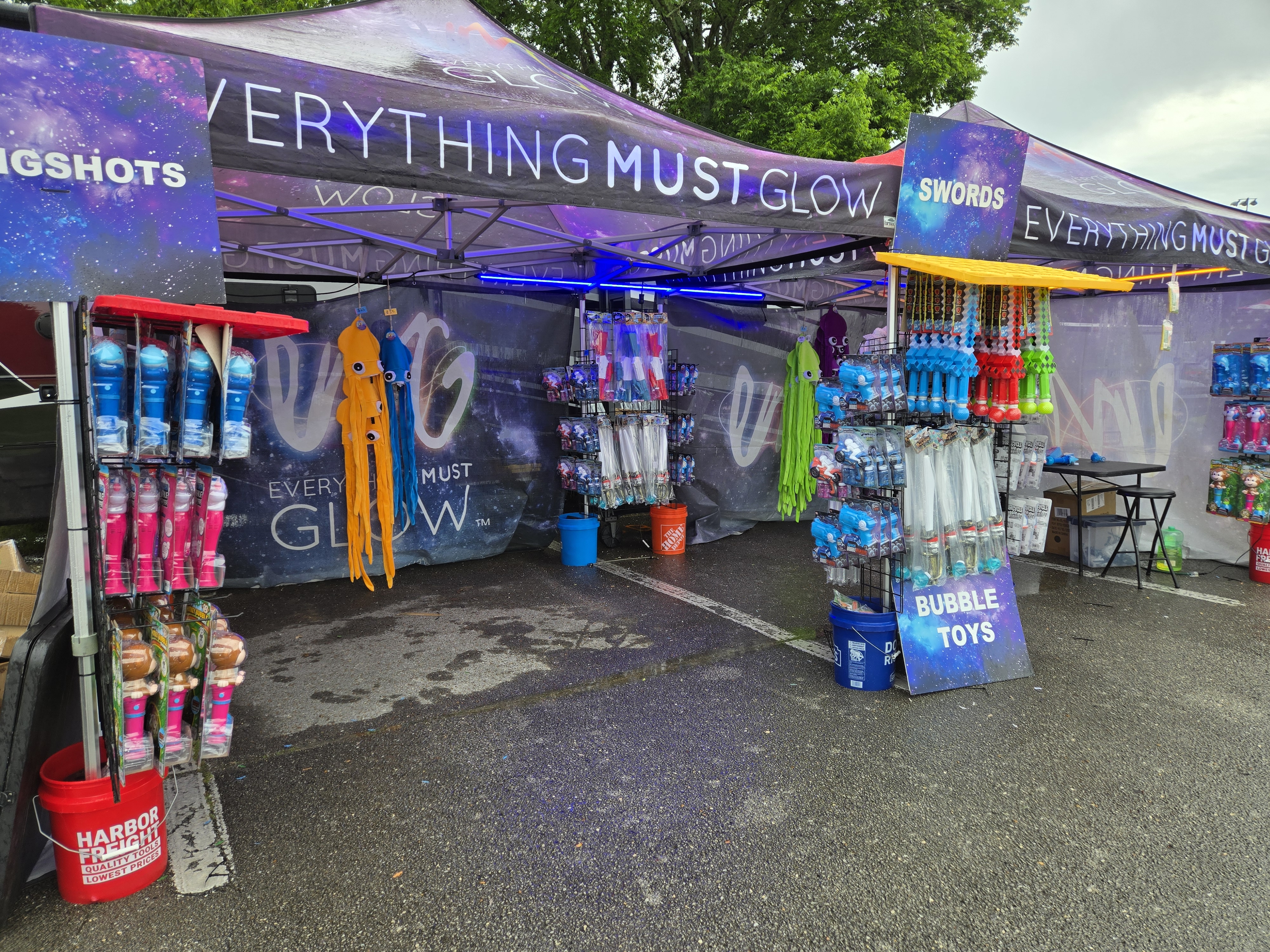 Our double tent booth fully stocked with swords, slingshots, and bubble toys