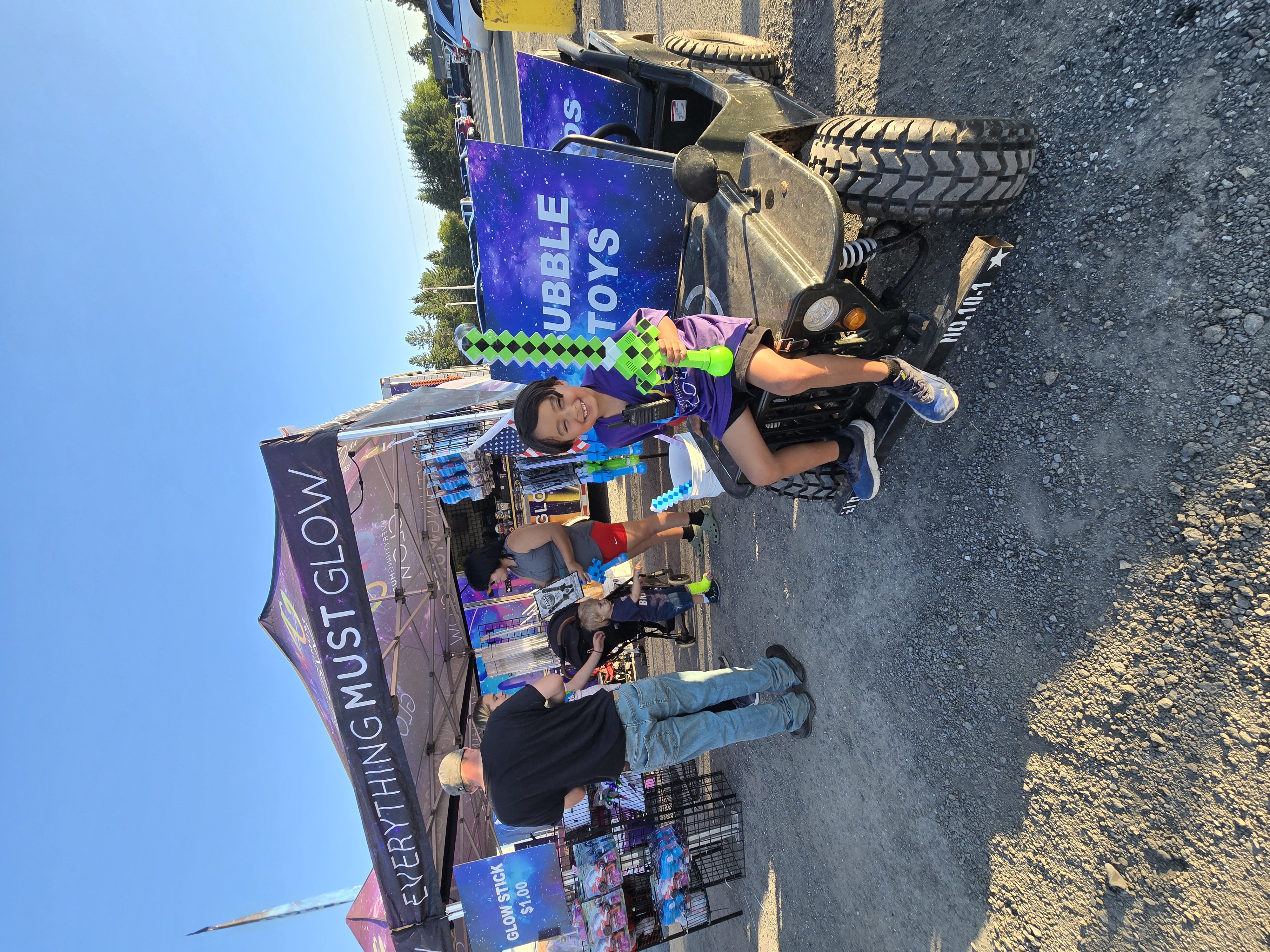 Our little man holding it down on the jeep with a pixel sword at the event