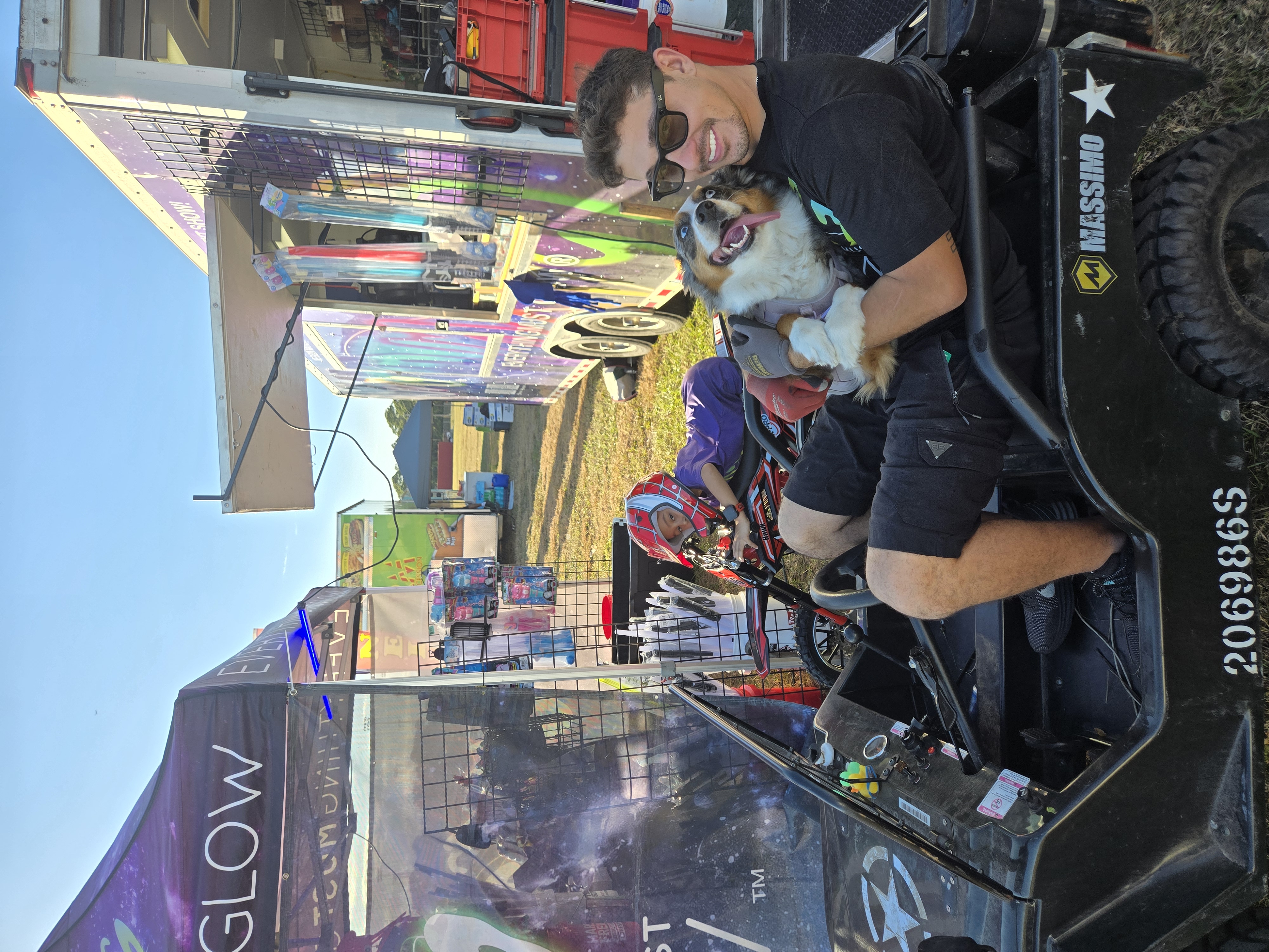 Bobby and the Aussie hanging out on the jeep by the trailer between shows