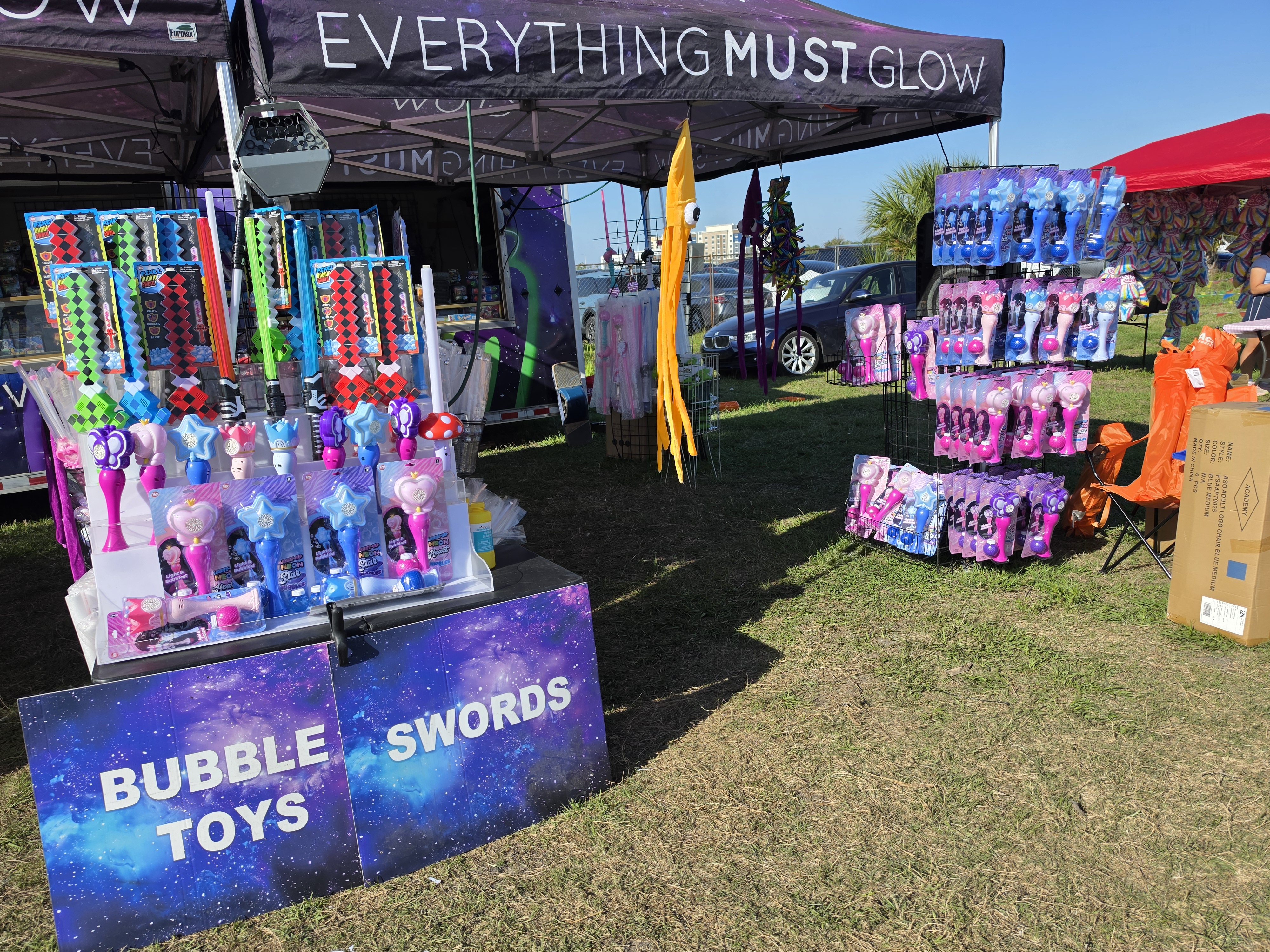 Bubble toys and swords on display at a daytime setup